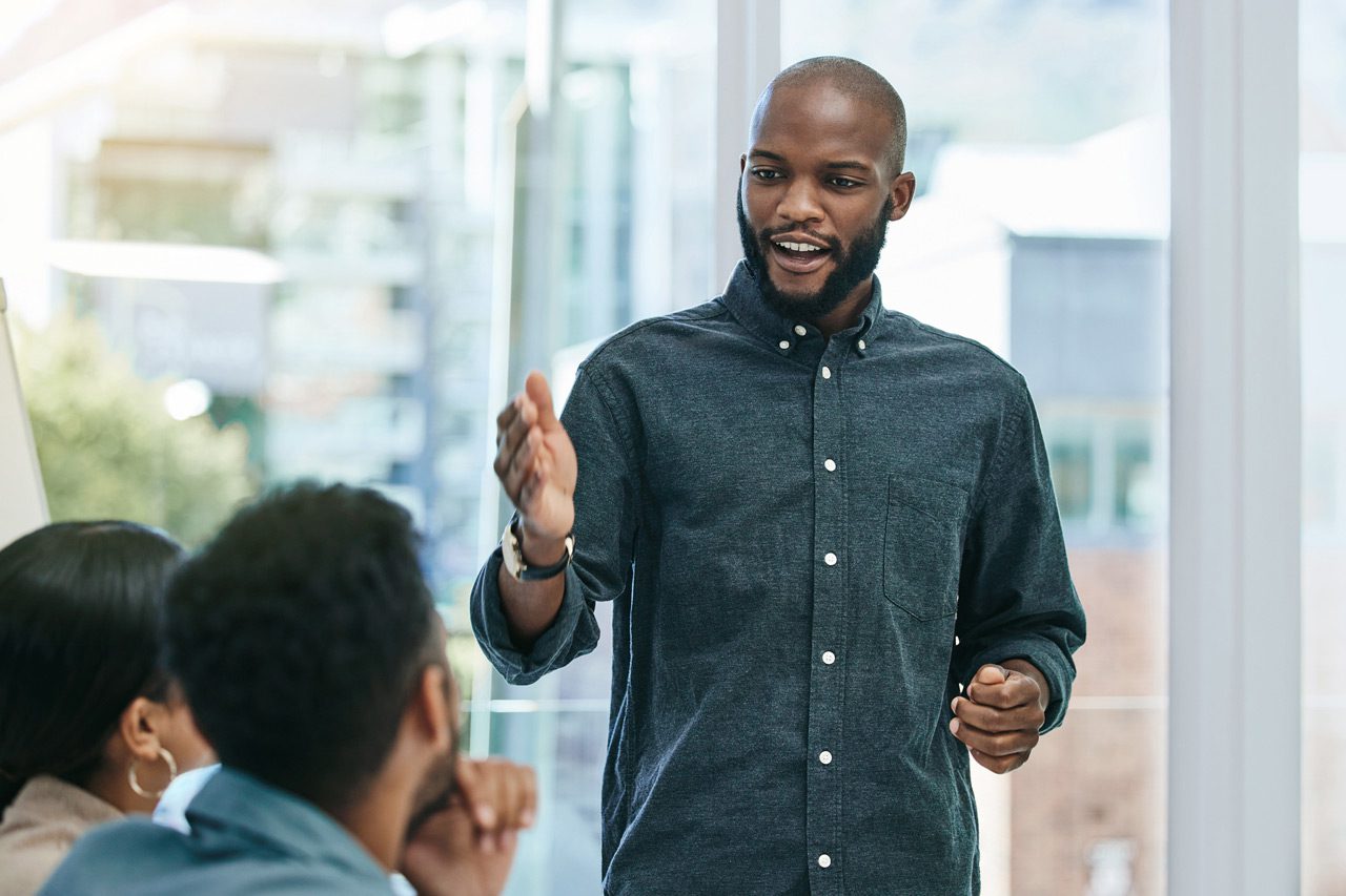 Businessman-giving-a-presentation-during-a-business-meeting