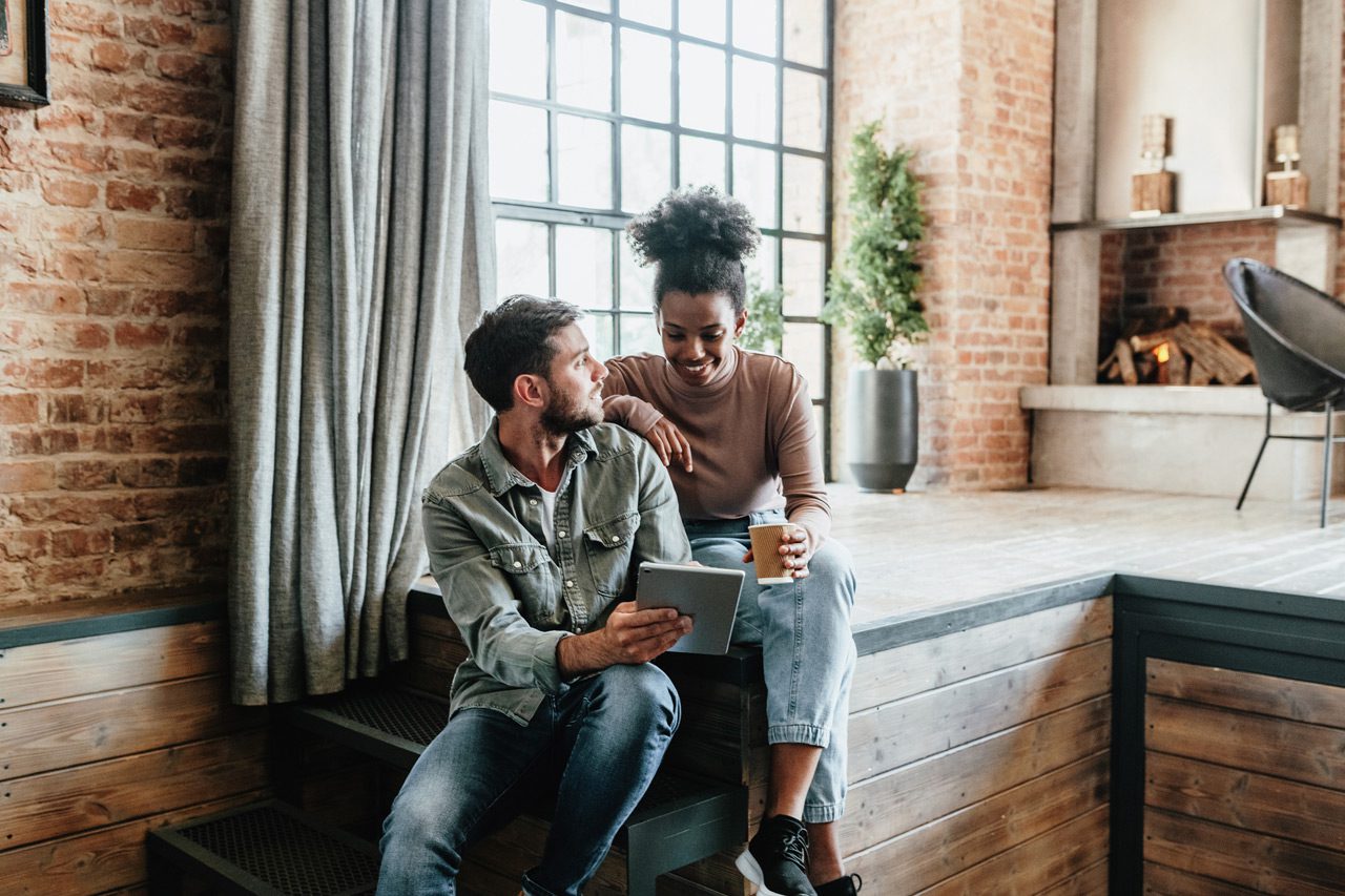 Couple-communicating-in-loft-apartment