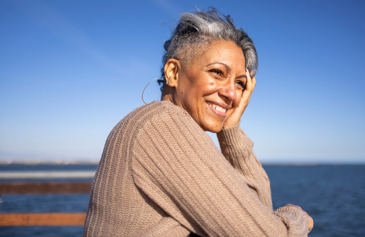 Mature-woman-relaxing-at-the-pier